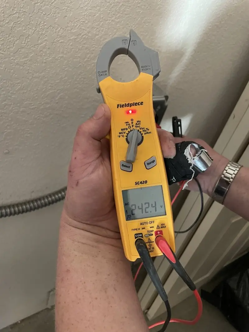 Voltage testing with clamp meter during Whole House Surge Protector in Pulaski